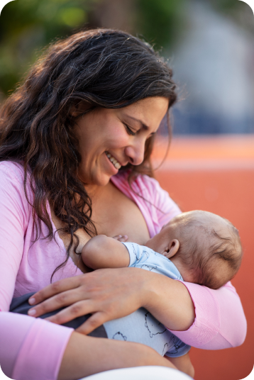 a woman breastfeeding a baby